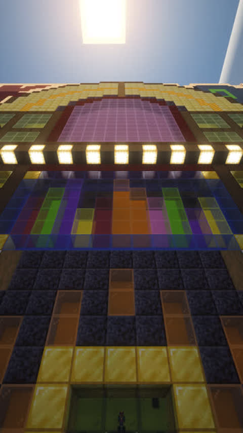 Camera pushes slowly up a street toward the front of a giant jukebox building that serves as a Minecraft server's spawn nightclub